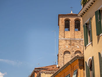 Low angle view of building against blue sky