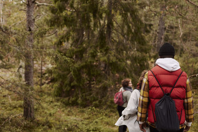 Group of friends walking in forest