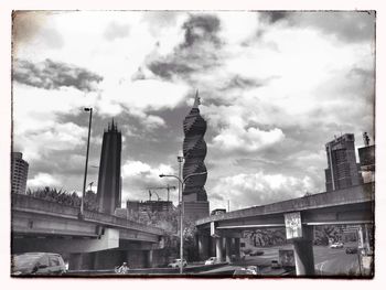 Low angle view of building against cloudy sky