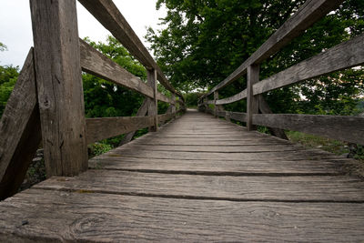 View of wooden footbridge in forest