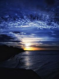 Scenic view of sea against sky at sunset