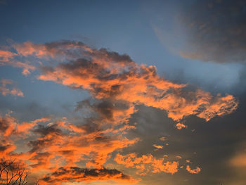 Low angle view of dramatic sky during sunset