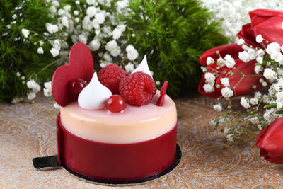 Close-up of strawberries and christmas tree on table