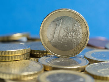 Close-up of coins against blue background