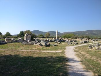 Scenic view of field against clear blue sky