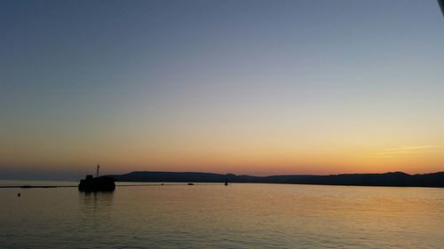 Scenic view of sunset over sea