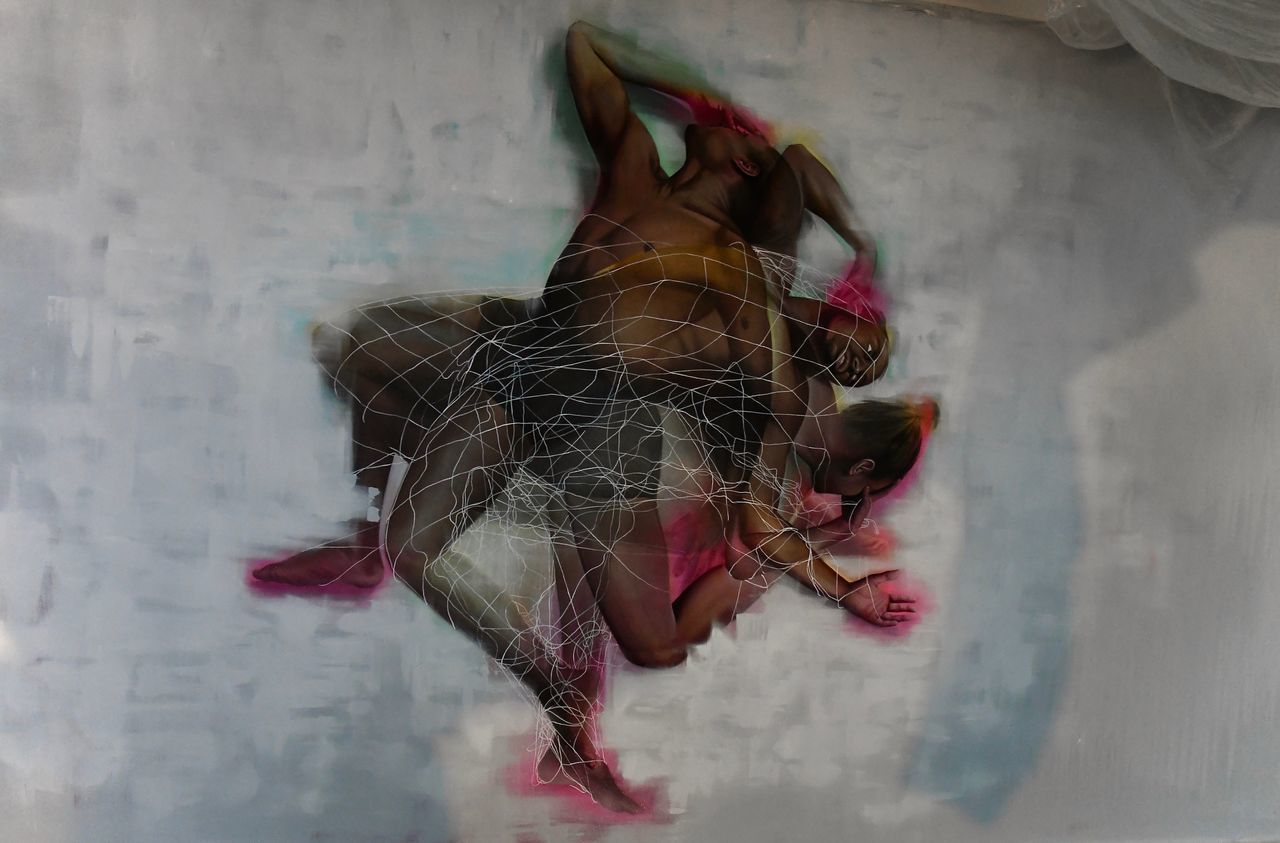 DIGITAL COMPOSITE IMAGE OF WOMAN ON WALL WITH HAIR