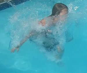 Woman swimming in pool