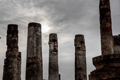 Low angle view of old ruins against sky