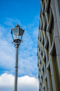 Low angle view of street light against sky