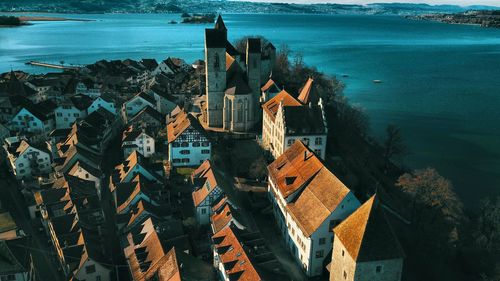 High angle view of town by sea