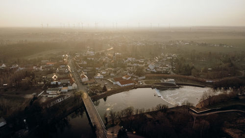 High angle view of river amidst buildings in city