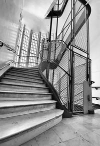 Low angle view of staircase by building against sky