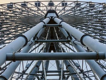 Low angle view of ferris wheel against sky