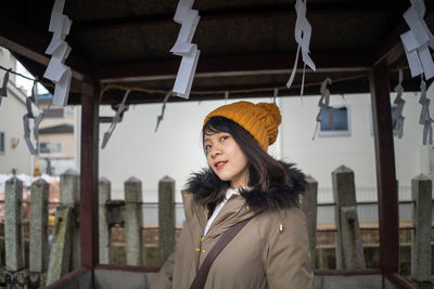 Portrait of young woman wearing warm clothing