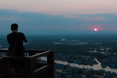 Man overlooking countryside landscape