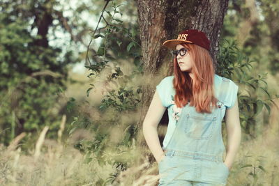 Woman standing in forest