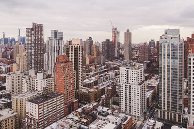 Modern buildings in city against sky in nyc