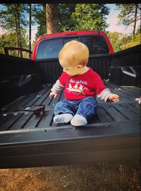 Boy sitting in car