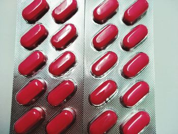 Close-up of colored pencils over white background