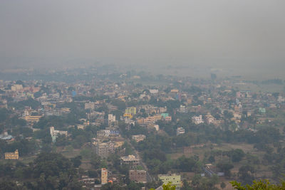 High angle view of buildings in city against sky