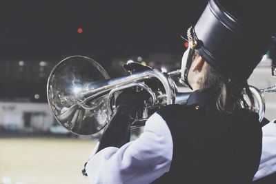 Close-up of man playing musical instrument