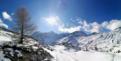 Scenic view of snowcapped mountains against sky