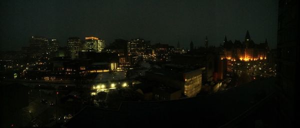 High angle view of illuminated buildings in city at night