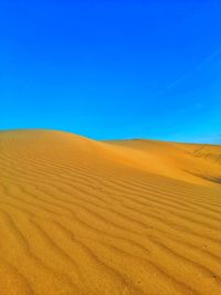Hill of sand dunes on desert