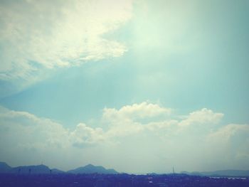 Scenic view of landscape against cloudy sky