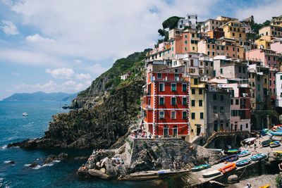 Scenic view of houses in village against sky