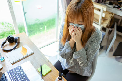 Young woman using mobile phone