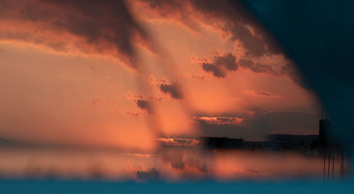 Scenic view of sea against romantic sky at sunset