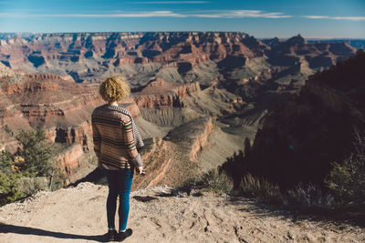 Rear view of woman looking at grand canyon