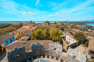 Aerial view of old town against blue sky