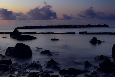 Scenic view of sea against sky at sunset