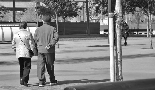 Full length of woman standing on road