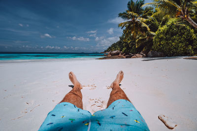 Low section of person on beach