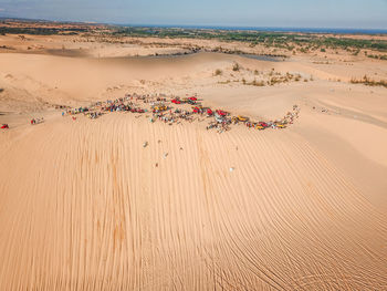 Sand dune in desert against sky