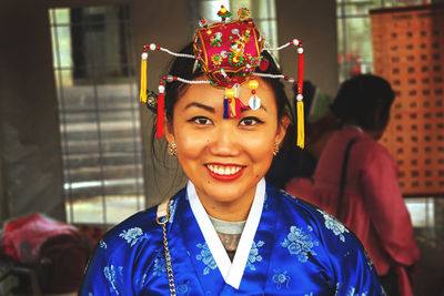 Portrait of smiling young woman in traditional clothing