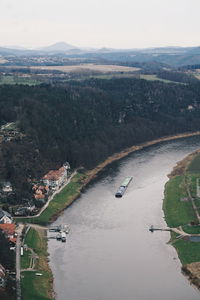 High angle view of lake amidst landscape against sky