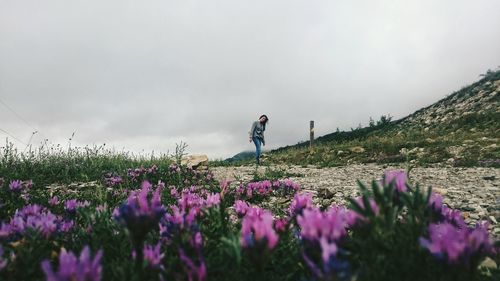 Woman standing on field