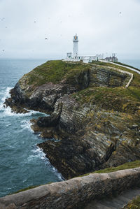 Scenic view of sea and buildings against sky