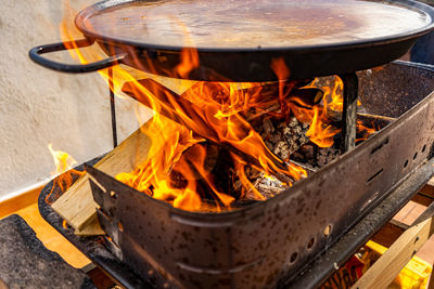 High angle view of fire on barbecue grill