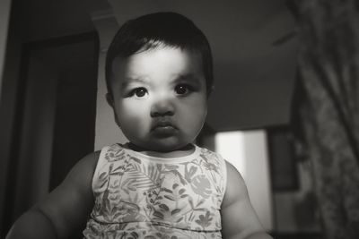 Portrait of cute baby at home