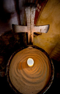 High angle view of cross on wood