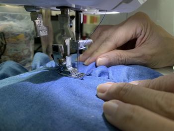 Midsection of man working at machine