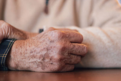 Midsection of man holding hands