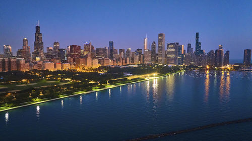 Illuminated buildings in city at night