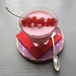 Close-up of red wine in glass on table